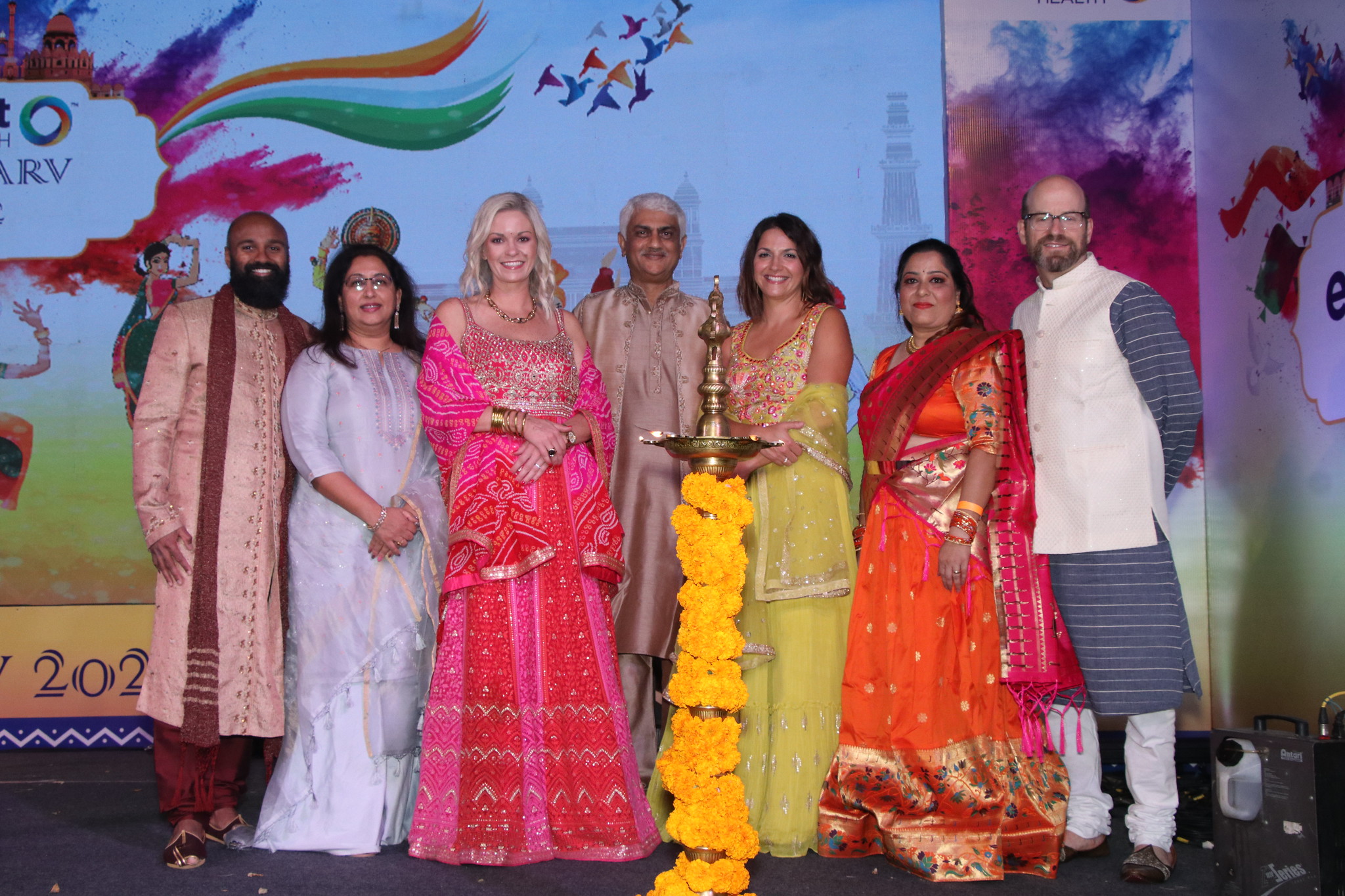 group of employees in our Pune, India office wearing bright traditional clothes