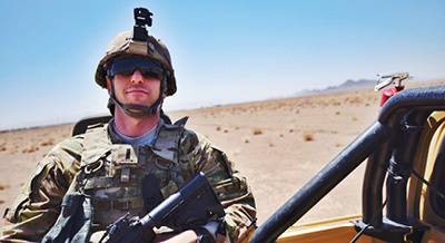 image of a man in army gear in the desert 